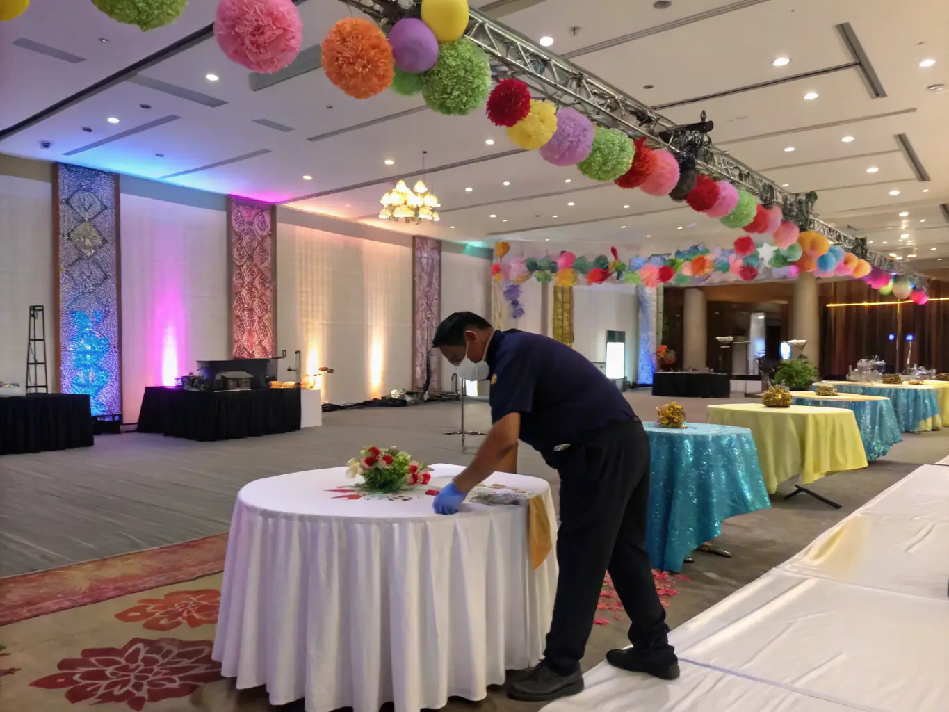 A photo illustrating the final touches being added to an event setup, with event staff meticulously arranging decorations and ensuring everything is perfect before guests arrive.